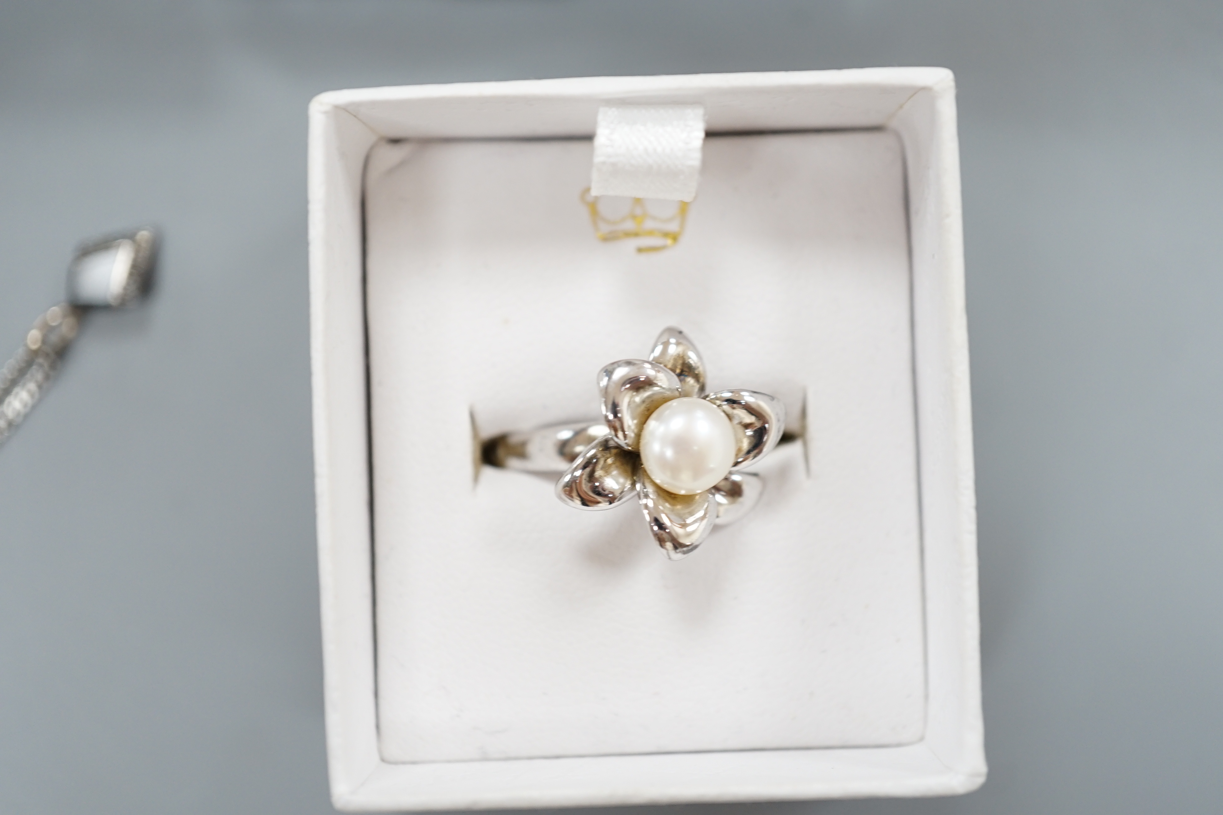 A small quantity of modern 925 and gem set jewellery and a Christian Dior quartz wrist watch.